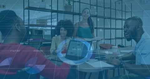 Diverse Team Strategizing with Digital and Printed Analytics