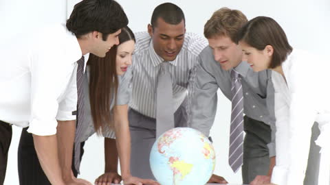 Diverse Business Team Discussing Global Strategies Around Globe