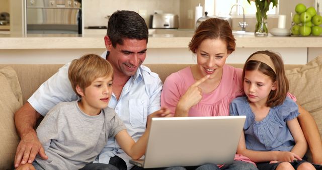 Smiling Family Using Laptop Together in Living Room - Download Free Stock Images Pikwizard.com