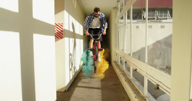 Stunt Cyclist Producing Vibrant Colored Smoke in Alleyway - Download Free Stock Images Pikwizard.com