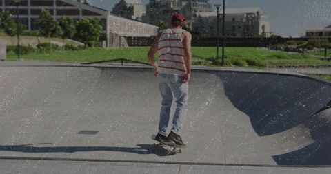 Skateboarder Riding Concrete Bowl in Urban Park