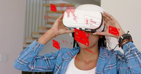 Woman adjusting vr headset with red holographic interface in home interior