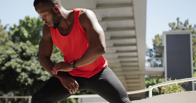 Active Man in Red Tank Top Stretching Outdoors - Download Free Stock Images Pikwizard.com