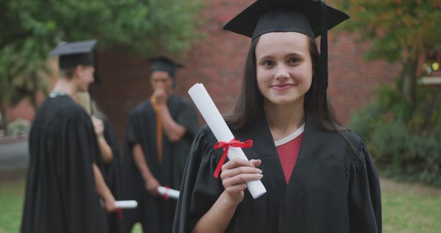 Proud teenage Caucasian girl at graduation, with copy space - Download Free Stock Photos Pikwizard.com
