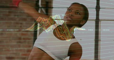 Active Woman Exercising with Digital Diagrams Overlay