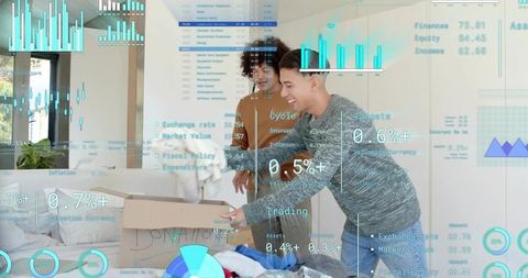 Young men packing donations in minimalist apartment with futuristic financial hud