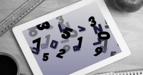 Digital tablet displaying floating numbers and letters