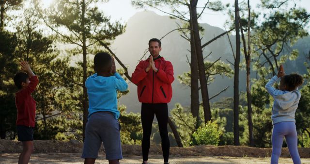 Yoga Instructor Teaching Children Outdoor in Forest Setting - Download Free Stock Images Pikwizard.com