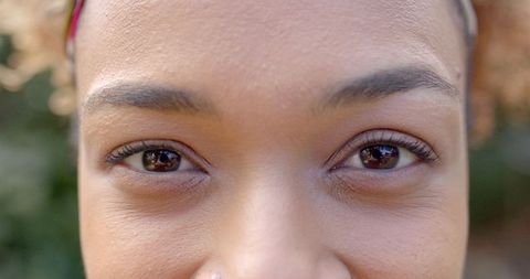 Close-up Portrait of Smiling African American Woman Outdoors
