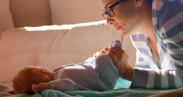 Mother Bonding with Newborn Baby in Sunlit Bedroom - Download Free Stock Images Pikwizard.com