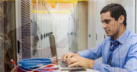 Business professional typing in data center with child overlay