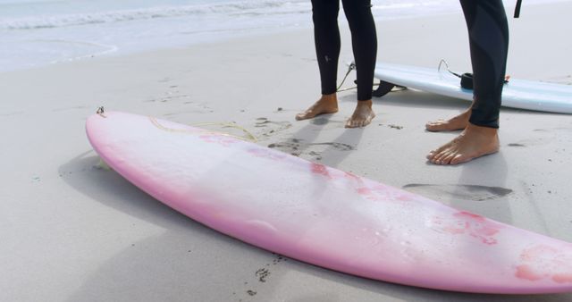 Surfers Preparing to Hit the Waves on Sandy Beach - Download Free Stock Images Pikwizard.com