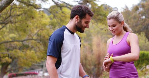 Couple Enjoying Outdoor Activity Checking Watch
