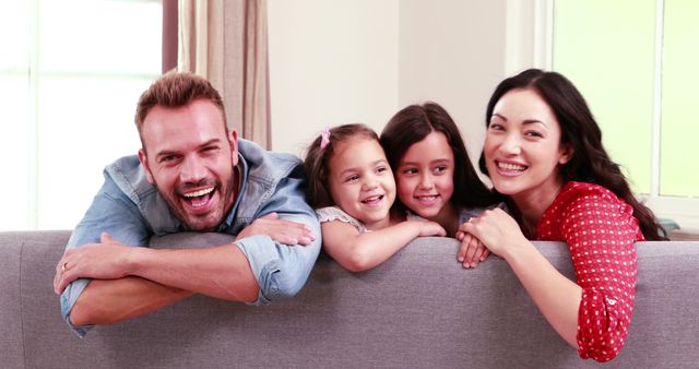 Happy Multiracial Family Enjoying Time Together on Couch - Download Free Stock Images Pikwizard.com