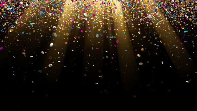 Colorful Confetti Cascades under Golden Spotlight Effects
