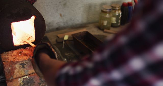 Craftsman Pouring Molten Metal into Furnace in Workshop - Download Free Stock Images Pikwizard.com