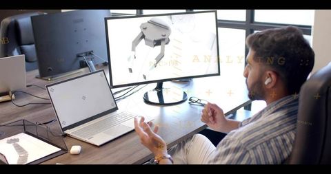 Design engineer presenting 3d robotic gripper model during remote collaboration session