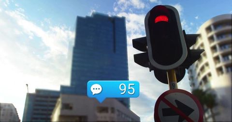 Urban Traffic Light Beside Tower With 95 Message Bubble