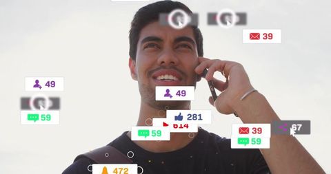 Young man talking on smartphone surrounded by floating social media notifications