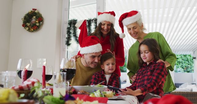 Multi-Generational Family Celebrating Christmas with Festive Dining - Download Free Stock Images Pikwizard.com