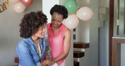 Joyful Birthday Celebration with Balloons and Smiles