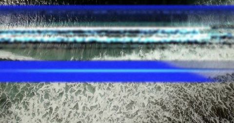 Aerial glitch seascape with breaking waves and blue bands creating coastal texture