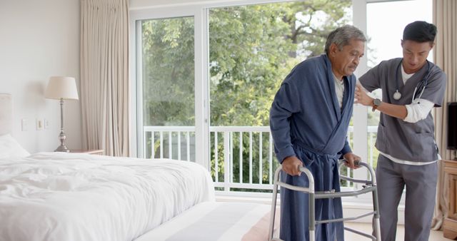 Senior Man using Walker with Help from Healthcare Professional at Home - Download Free Stock Images Pikwizard.com