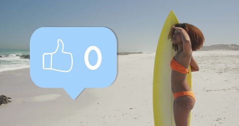 Woman holding surfboard on beach with digital thumbs up icon