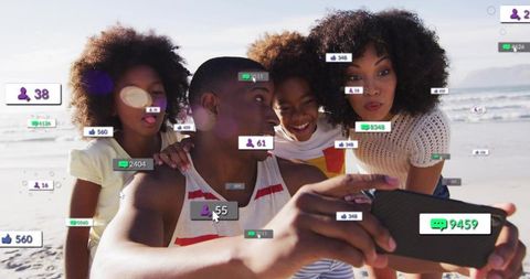 Black family taking beach selfie with social media reaction overlays and engagement icons