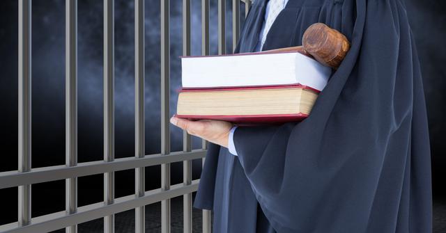 Image depicts judge holding law books and gavel next to prison bars, symbolizing justice and legal authority. Useful for legal services, law enforcement themes, criminal justice presentations, and educational content related to courtrooms and legal systems.