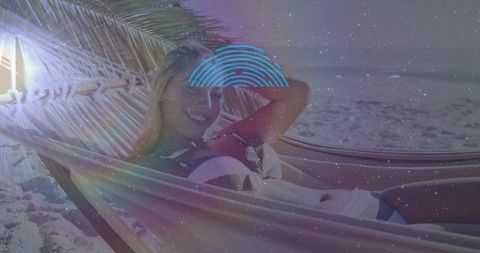 Relaxing in Hammock on Tropical Beach at Sunset