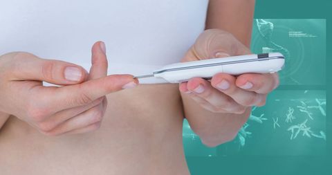 Woman checking blood sugar with glucose meter for diabetes management