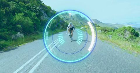 Cyclist on scenic mountain road with digital heads-up display overlay