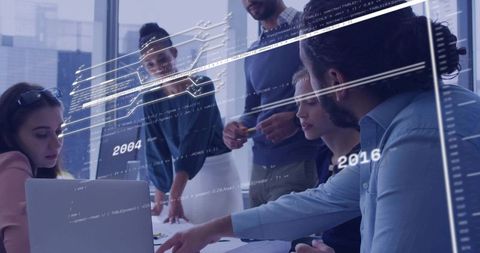 Business team collaborating on augmented reality data visualization in modern glass office