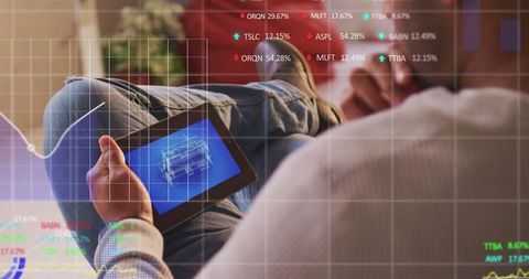 Man Analyzing Stock Market Data on Digital Tablet
