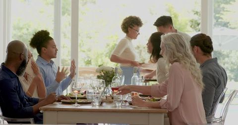 Fun atmosphere at wedding reception with diverse guests