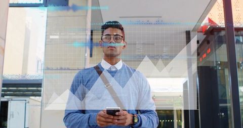 Urban professional holding smartphone checking digital charts in sunlit daily commuter hub