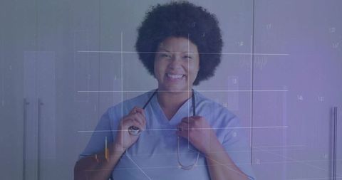 Smiling Nurse in Scrubs Holding Stethoscope in Modern Clinic