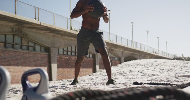 Athlete Exercising with Medicine Ball on Sandy Beach - Download Free Stock Images Pikwizard.com