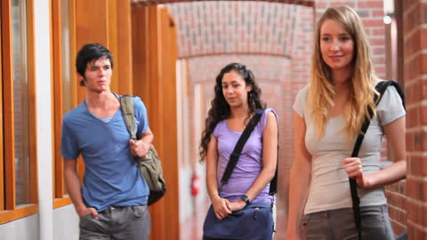 Diverse Group of Students Socializing in University Corridor
