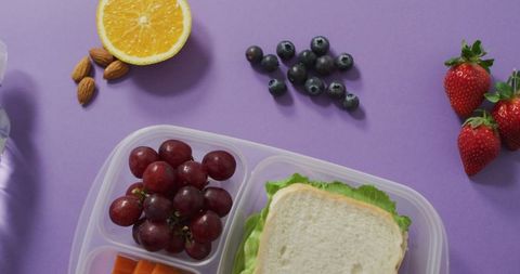 Healthy vegan packed lunch with fruits and vegetables