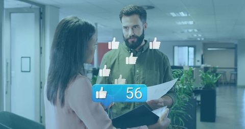 Colleagues analyzing engagement metrics in modern office