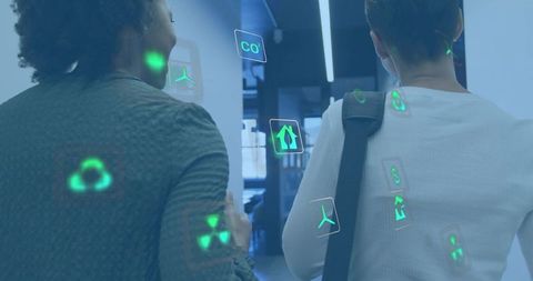 Two professionals walking through office corridor with augmented reality data overlays