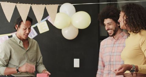 Colleagues celebrating at office baby shower party