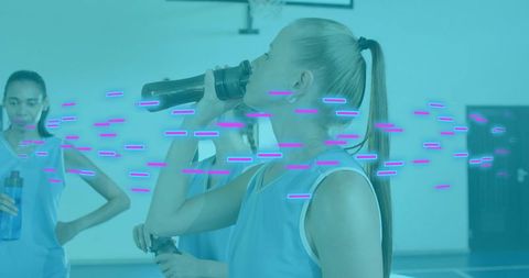 Blonde athlete drinking from sports bottle during basketball training with neon overlay