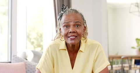 Surprised Senior African American Woman Indoors with Headband