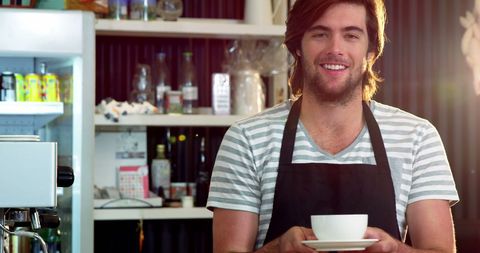 Friendly Barista Serving Coffee with a Smile in Cozy Café - Download Free Stock Images Pikwizard.com