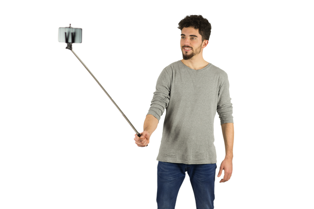 Casual Man Using Transparent Selfie Stick in Studio - Download Free Stock Videos Pikwizard.com