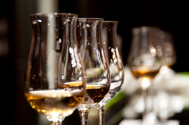 Close-Up of Elegant Wine Glasses with Amber Liquid - Download Free Stock Photos Pikwizard.com