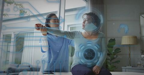 Digital rehabilitation: therapist assisting patient at home with digital interfaces